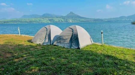 couple tents near lake